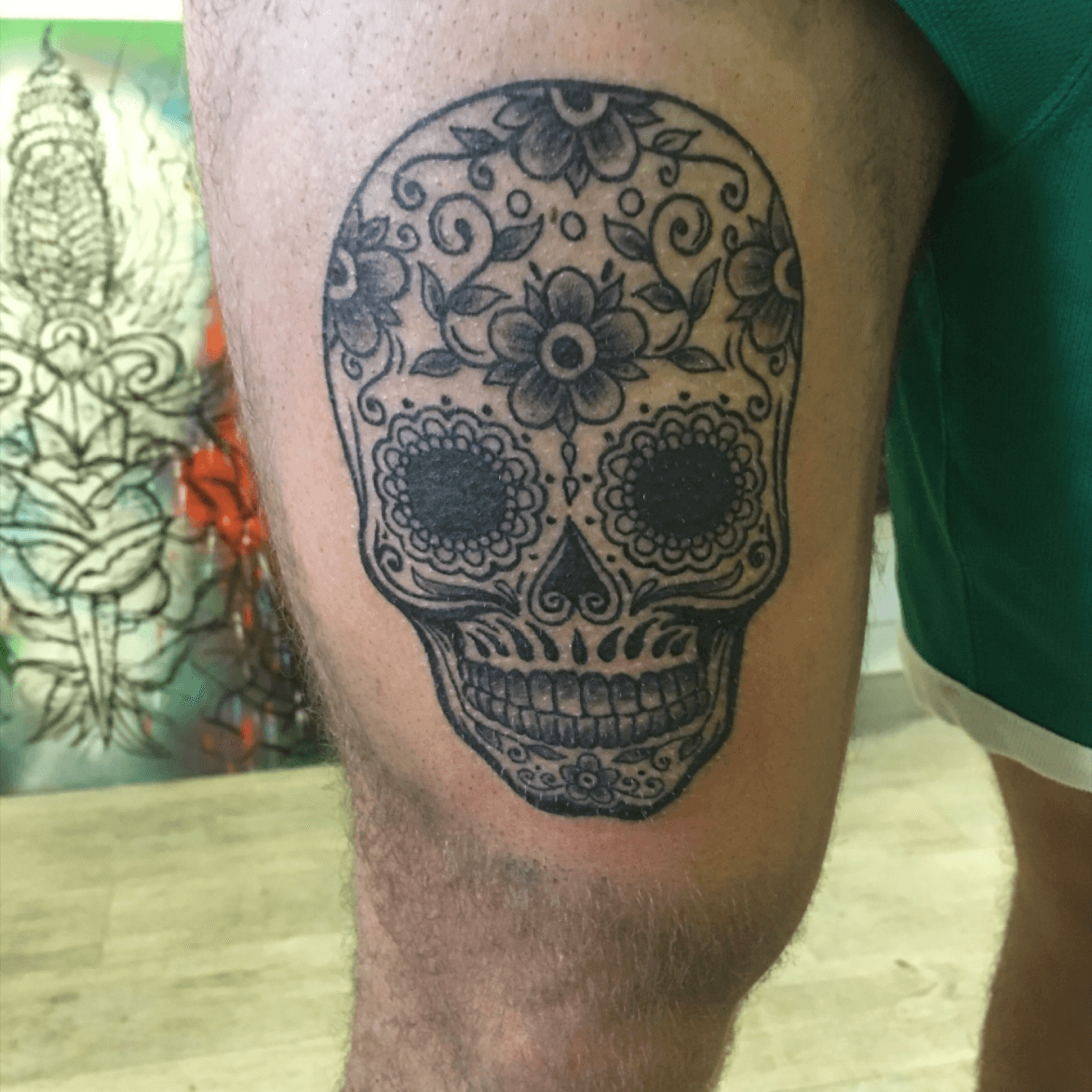 sugar skull tattoo on thigh