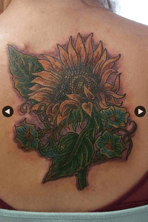 I got this tattoo when I turned 18 as my first. For starters I love wildflowers and growing up my mom always told me that I reminded her of wildflower because I wanted to be wild and free just like her. My dad (actually step dad who impacted my life majorly!!!) used to work out in Rio Vista California in the middle of big fields where all that grew were weeds and sunflowers and he used to bring a sunflower home every day just for me while growing up. I got the sunflower because of the impact he had on my life. Also underneath the sunflower or another type of wild flour called “forget me nots”. These flowers represent my great grandmother (who I called GG) Who passed away when I was about eight years old she was probably one of the most strong women I have ever met my life she was loving and caring and in her eyes it was our job as a family to take care of one another. My family has more men than we do women, but the women in my family are all the same we are all strong-willed, independent, and feisty, but we know how to love each other and take care of one another even when we can’t take care of ourselves and that’s something I want to remember for the rest of my life. This is my only color tattoo and I plan on keeping it my only color tattoo because it represents the inner workings of myself and where I came from and that deserves to be more bold than the others.
