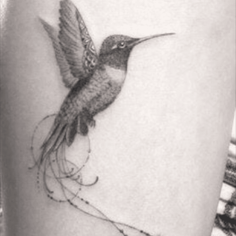 Fine line hummingbird tattoo on the wrist