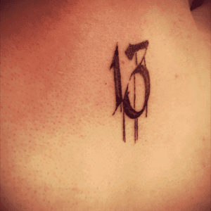 My 13 tattoo (back if the neck) is meant to represent my opposition to superstition.