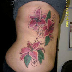 Second tattoo Dec 2009- three stargazer lillies. My moms favorite flower and one for each of my sisters!