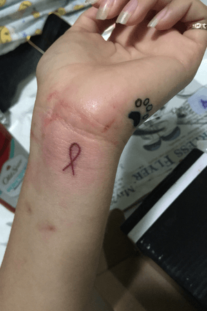 Cancer ribbon and dog paw