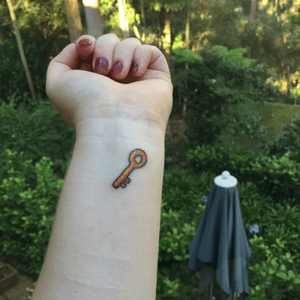 Emoji key tattoo