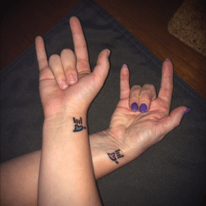 Mother daughter matching ASL "i love you" tattoos!
