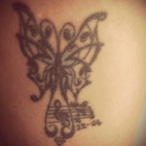 Got this art after my dad was shot. Im the butterfly as i was busy with a transformation.. moving 660kms home to be close to my mom, starting over and living without my dad.. turqouise represents my mom.. the music notes was me and my girls and the diamond my dad as he was a diamond cutter.. the date is when i got the tat
