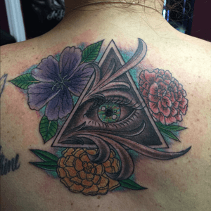 Illuminati eye with flowers