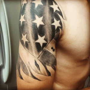 Worn American Flag with bullet holes 