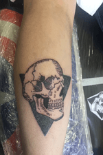 Skull with a dotwork background on leg