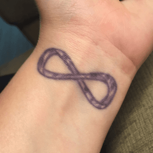 Inner left wrist tattoo- purple zebra striped infinity symbol-8 - was done on a trip with the girls in florida. Shittiest artist ever- has already been touches up once- will be getting it redone when I can. 