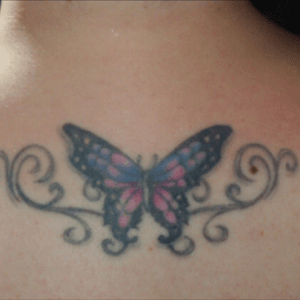 This is of my 2nd tattoo (2007), after it healed up.  Sorry its a little blurry.  #butterfly #butterflytattoo #filigree 