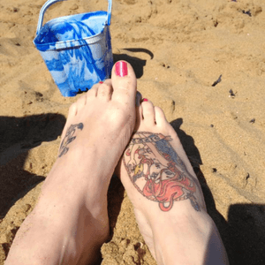 Both feet tattooed ~ anchor on left & mermaid on right 