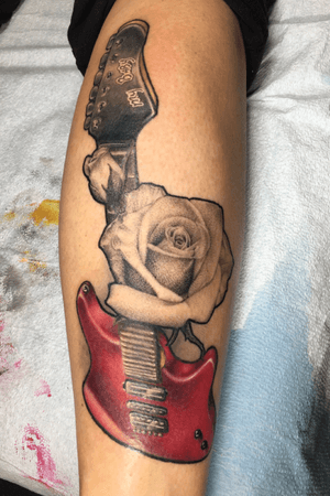 Rose and guitar memorial tattoo