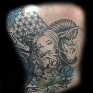Horned maiden with sacred geometry and lotus flowers