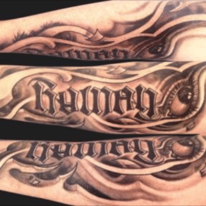 Custom half sleeve with my son's name (Rowan) written as an ambigram. It was created in a combination biomech/tribal style with the ambigram "inside" my arm. Symbolizes strength, intelligence and love.