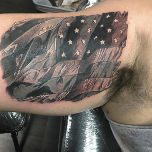 Flag tattoo for a client! #americanflag #flag #blackandgrey #blackandgreytattoo #greywash #realistic #biceptattoo #patriotism #america #tattoo #ink #inked #original #customtattoo #customdesign 