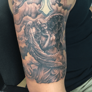 Heres an angel i did added on to a cross that the customer did 9 years ago. Done by #keegankeelikoga of #trapinktattoosfl in #sarasota #florida #angel #religious #religoustattoo #tattoo 