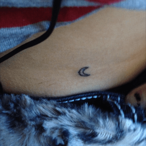 A crescent moon tattoo I did myself when I was 14 years old. 