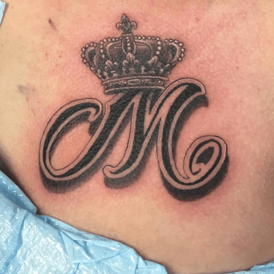 Crown On M Letter Tattoo On Right Half Sleeve