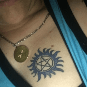 Anti-possession symbol from Supernatural with blue flames