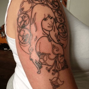My first BIG tattoo. Shes an art novoue style lady with Docotor who symbles around here. 