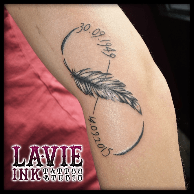 Beautiful Infinity Feather Tattoo with Lettering Design  Black Poison  Tattoos