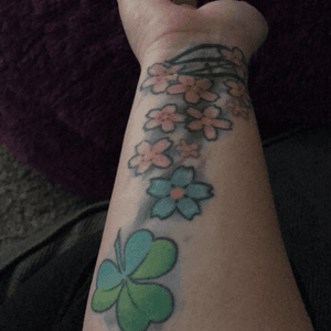 Shamrock by Daniel at Slave to the Needle in Seattle. Flower CF worked on by too many artists to name and they're still my least favorite of everything. At least they hold meaning! Lol