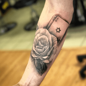 A realistic rose with cards and david star 
