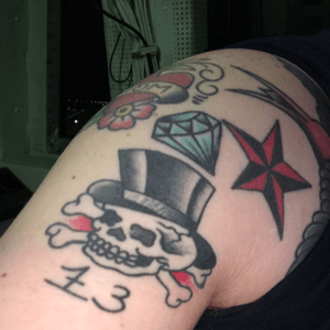More small bits of my half im working on. So, the skull was honestly a flash, but I enjoy the concept of the unlucky being lucky, and 13 is my lucky number. It was also my 13th tattoo (not a friday the 13th tattoo). I chose the top hat because I try my best to keep it classy, and whats classier than a tophat! The diamond is because I struggle with body issues, but I like to think i'll be a diamond for somebody someday! The Nautie, well I'm in the Navy, and for us it's for an extra 5,000 miles at sea, but after two deployments I think I'm a tad over that now. 