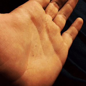 The three dots on my left palm represent the trinity, and remind me that no matter what, God is always with me. The placement is a tad strategic, in that whenever i cry, i use my hands to wipe my tears away, and my palm is the only thing i can see. This way, when i am crying, i am reminded that God is with me. 