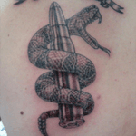 I want a patriotic tattoo similar to this. I would replace the bullet with a full color american flag and have the snake striking towards the viewer. I want more detail in the snake. I am not sure where i want this yet, but I am limited due to Air Force uniform regulations. I would love placement ideas and also different ideas for the tattoo! #dreamtattoo #Gadsen