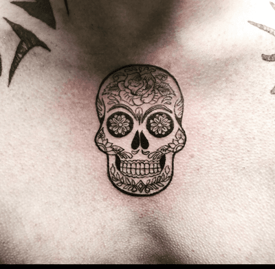 tiny sugar skull tattoo
