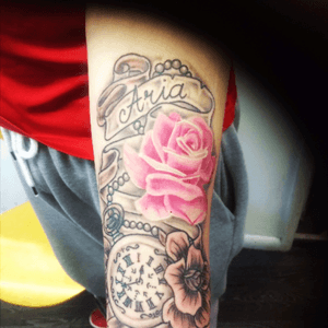This tattoo represents a little baby Aria whos had heartsurgery at such a young age the clock represents her birth and luckily shes fighting strong and constantly smiles, love doing tattoos like this #tattoo #tattoo_art_worldwide #tattoo_artist #tattedskin #pinkrosetattoo #pink #rose #clock #scrolls 