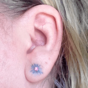 I love my new #ink ! It is pretty, dainty & girly - i am getting different ear rings to have different looking #flowers #cornflower #floral #blueflower with #ear #Pierced #earlobe #earlobetattoo  