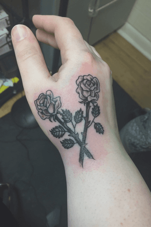Crossed roses done on right hand
