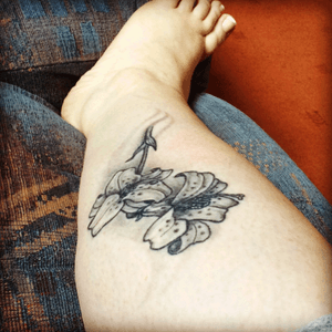 Lilies tattoo by Gavin Blackgold Studios
