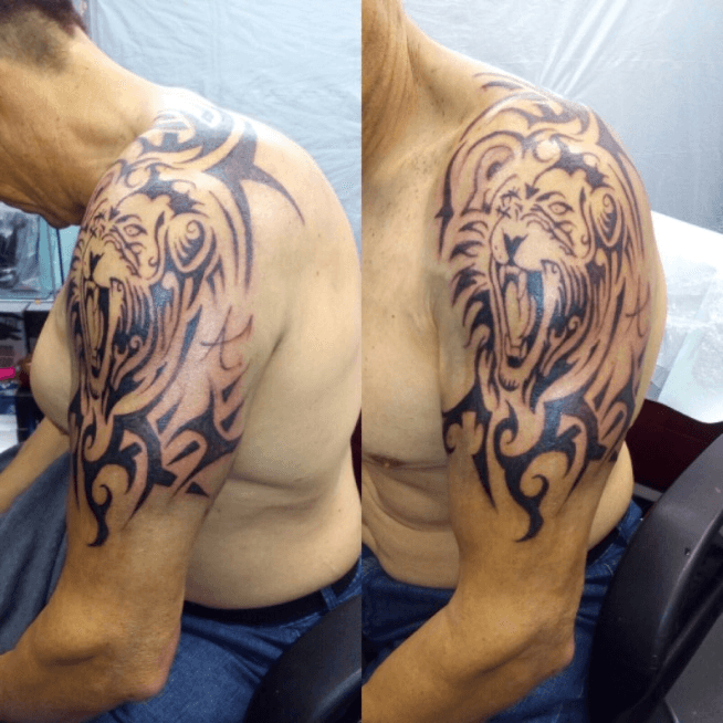 Tattoo uploaded by An_geloop • Tribal Lion. #tribal #black #ink #tattoo # lion #shoulder. IG@an_geloop • Tattoodo