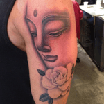 Black and grey Buddha with rose