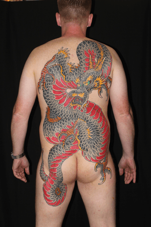 Get an awe-inspiring Japanese dragon tattoo by Stewart Robson to showcase strength and power on your back.