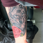 I got this tattoo done at Dragon Fx by Chantelle Tousignant on Sept 11th 2014 #wolftattoo #wolfportrait #blackandgreysleeve #RoseTattoos #realismtattoo #greywolf 