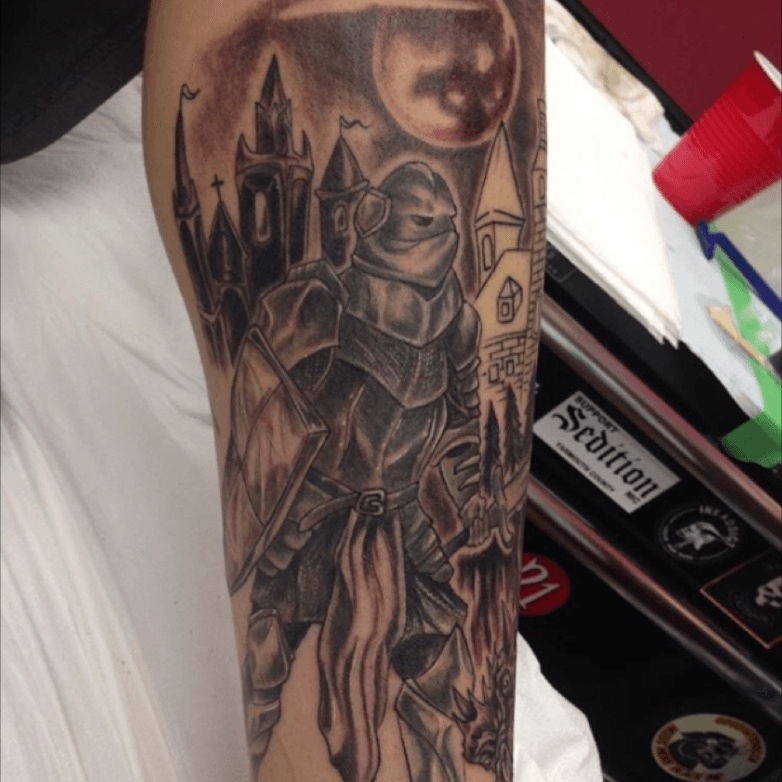 Knight tattoo on the inner forearm