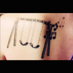 My first tattoo. Almost two years old. A swingset to represent the timeline of my life. Since ive been swinging before i could walk and still do as often as i can to this day. Its my happy place. Two swings. One for me, one for my sister; my built in best friend. Musical noted to represent the music thats always been a part of my life. From lessons to writing to the music thats always been alive in my family. #firsttattoo #swingset #2yearsold #music #musicalnotes #swing #happy 