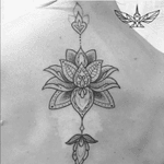 #lotus done with #black #lines and #dots along the #spine by #tattoo #artist #finelinetattoos @fine.line.tattoos 