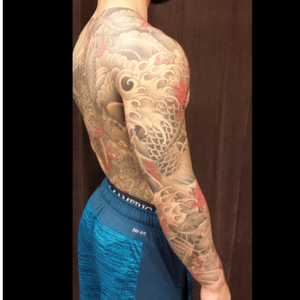 Back side of koi sleeve and full back tattoo by Vincent Moisdon