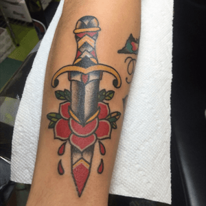 I love American Traditonal work, so I got this dagger done to start a Traditonal sleeve #dagger #rose #americantradional #colors 