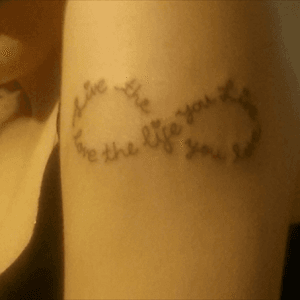 This was my second tattoo and one that also means alot, (they all do!) i have had lots of stuggles in my life and this helps me to remember that it does get better! The quote is: 'live the life you love, love the life you live' 