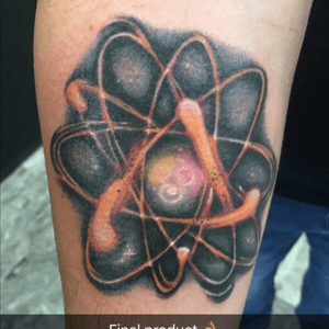 An atom because i work in nuclear power plants and in the nucleus i got the birthstone color of my mom, dad, and brother done by bob z at symmetry 6 art studio in fort worth TX 
