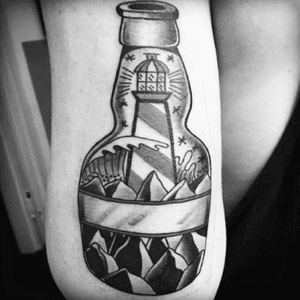 My last tatto made in munich by identitymunich #bottle #lighthouse #sea 