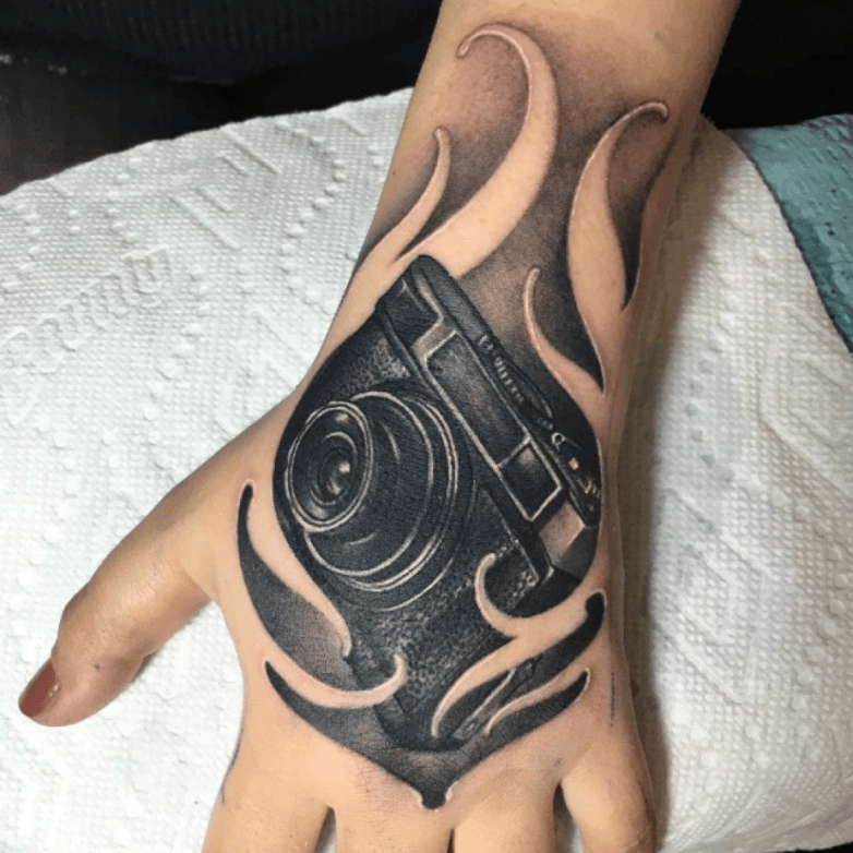 addison create a sketch of a black and white camera tattoo design