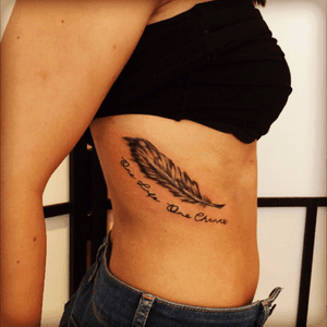 A small simple feather tattoo #feathertattoo #feather #writing #ribs #tatoveringodense #houseofink #houseofinkodense #apprentice #tatoveringdanmark 