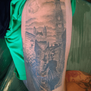 Jack the Ripper Victorian street scene thigh tattoo by #schillingoriginal. #jacktherippertattoo #london #bigben #victoriantattoo #londonbridge #blackandgreytattoo #chanesaddiction 